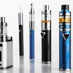 modern electronic cigarettes or vaping devices on white background. Selective focus