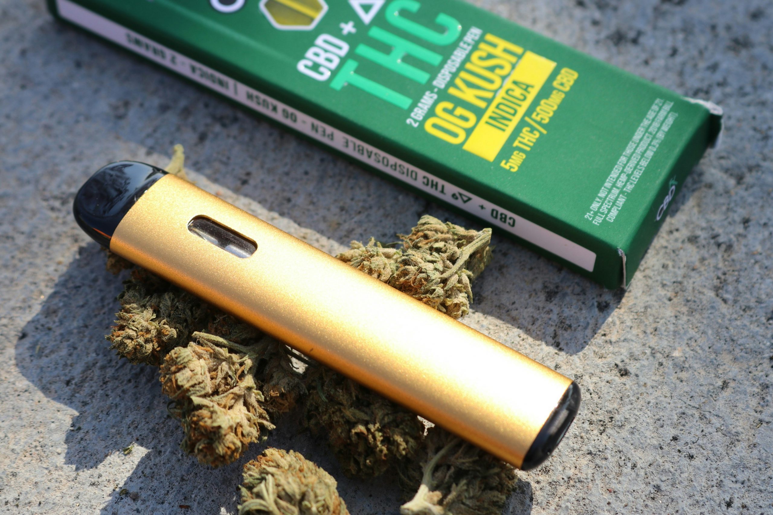 disposable vape on top of cannabis buds