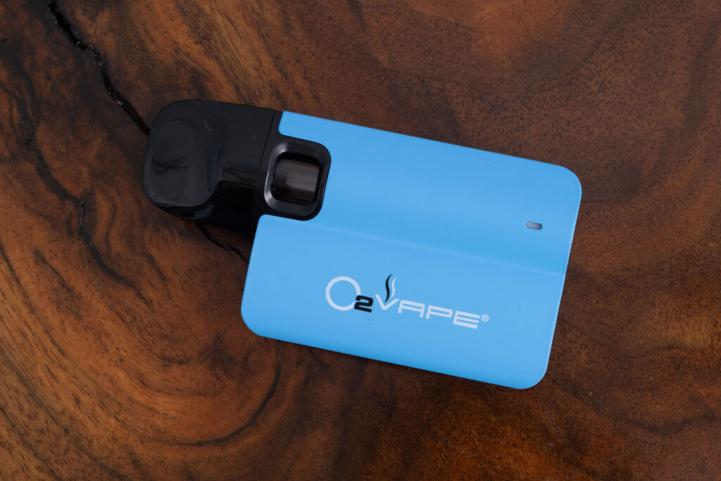 Compact and sleek O2VAPE Glass Nano Pod System fully assembled—USB-C rechargeable battery with magnetic glass pod connection